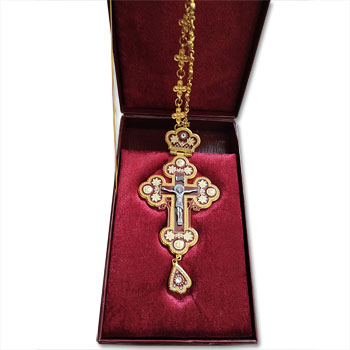 Gold plated chest cross in the box